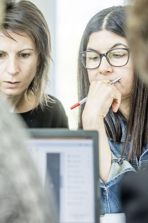 teachers looking at computer screen